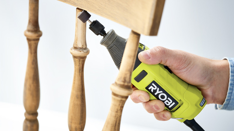 Ryobi Corded Rotary Tool in use with chair