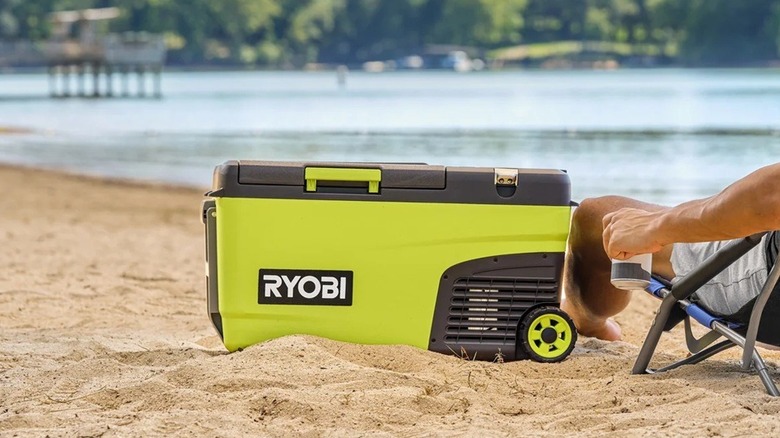 Person using Ryobi power cooler on beach