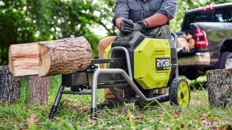 Person using Ryobi log splitter