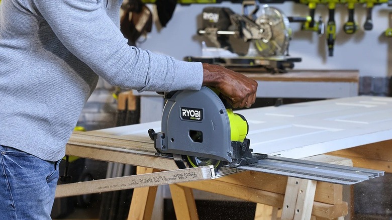 Person using Ryobi track saw