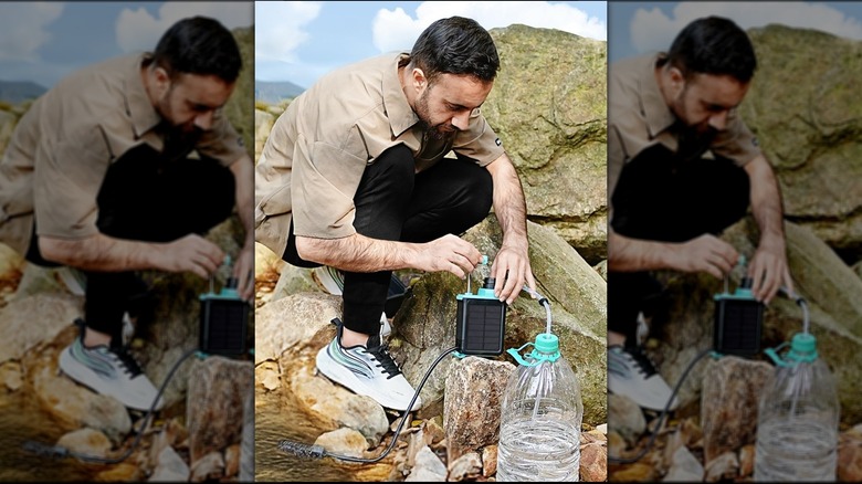 Man using device to filter water into a clear jug