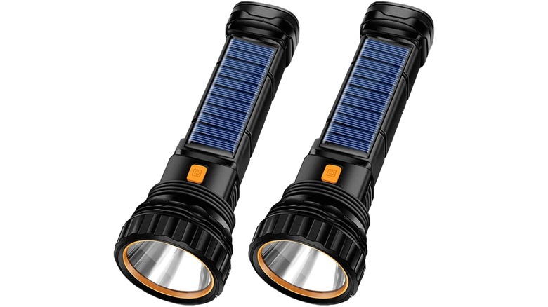 Two solar flashlights set against a white background