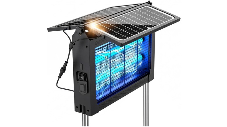 Black flat bug zapper with blue lights and solar panels on top against a white background