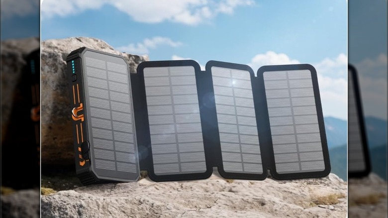 Four solar panels in the sunlight on a rock