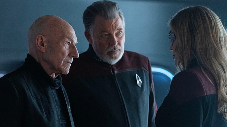Picard and Riker looking together