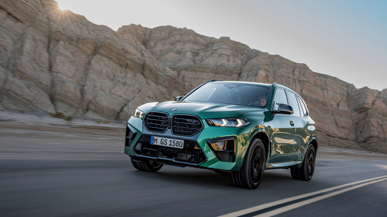 2025 BMW X5 M Competition dynamic image front 3/4 view