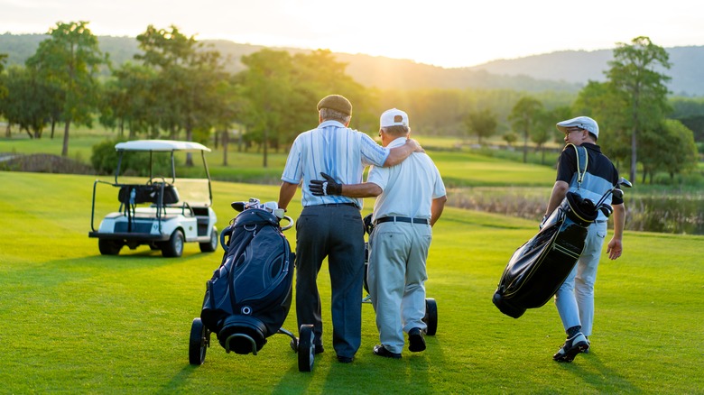 A group of golfers on the green