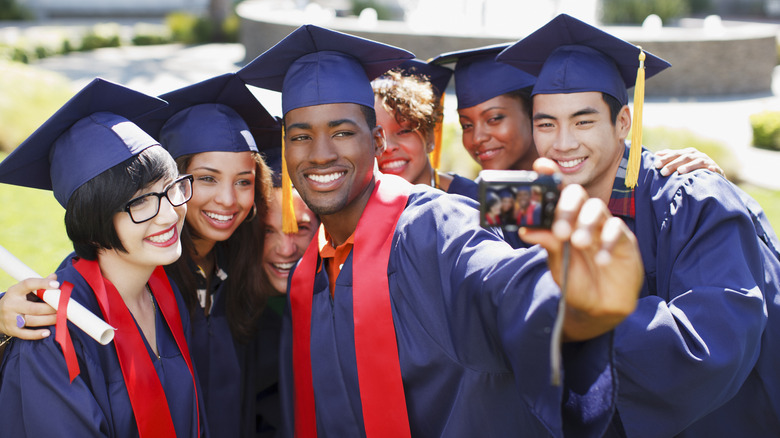 Group using a digital camera for a selfie