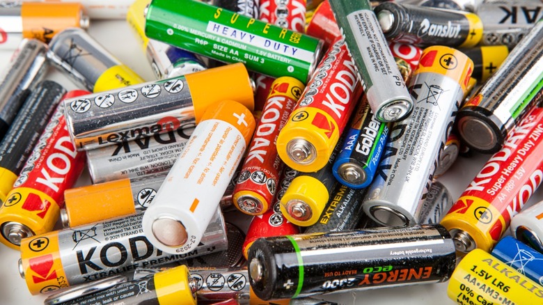 a cluttered stack of batteries