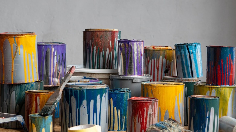 a stack of open paint cans