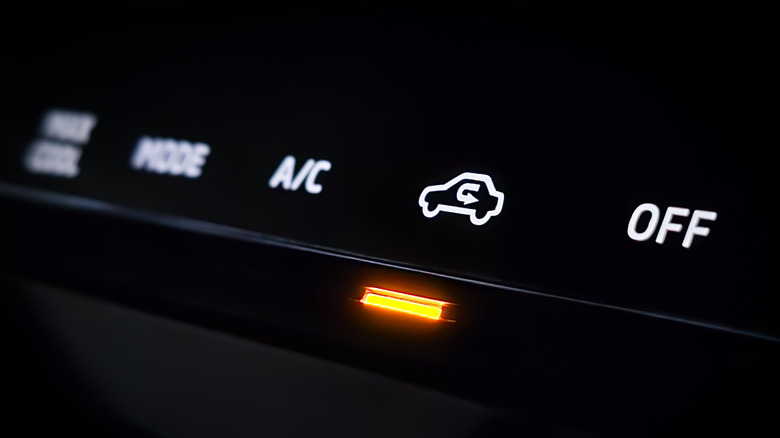 The recirculation button on a car turned on