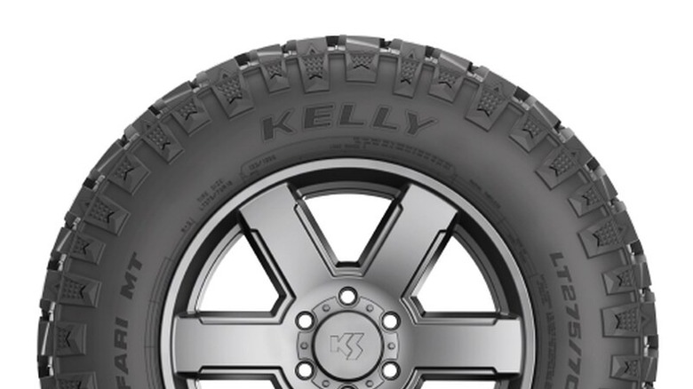 Kelly Safari MT tire with aggressive tread pattern, shown mounted on a silver alloy wheel.