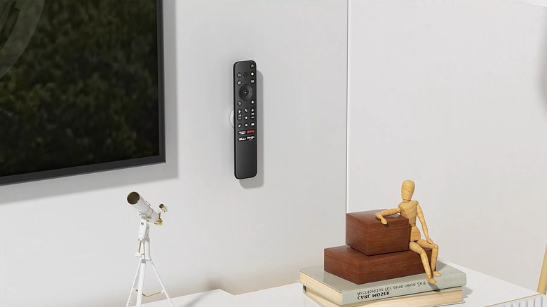 Magnetic remote holder on wall
