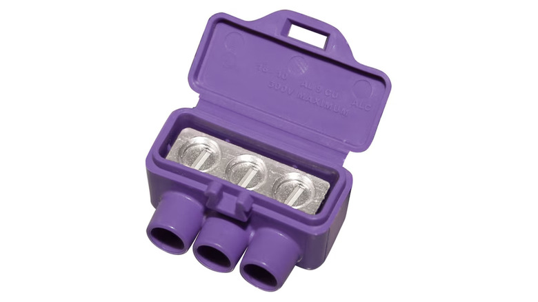 A purple wire connector made for aluminum and copper