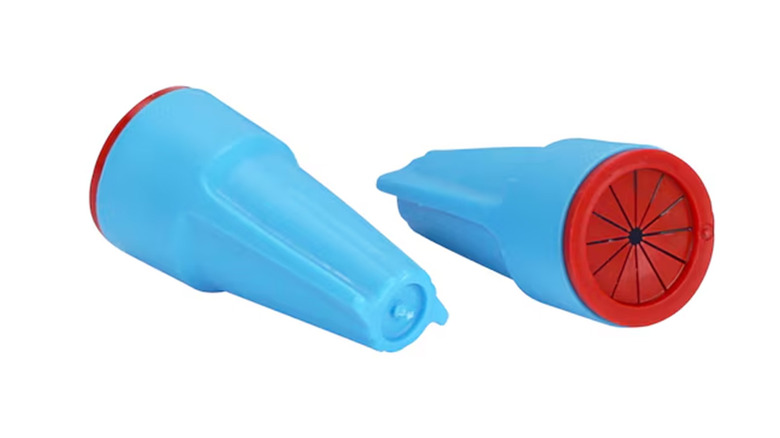 A waterproof wire connector in blue with red rubber