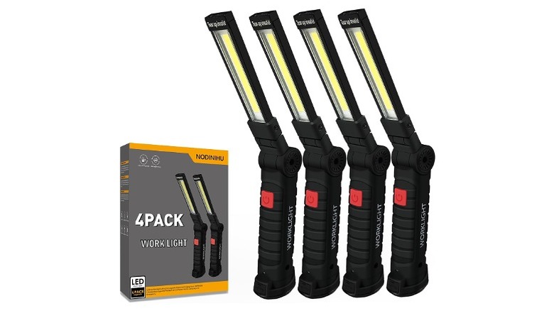 Four foldable work lights along with a box.