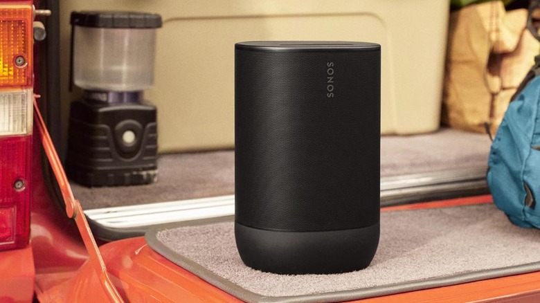 Sonos speaker placed on a table mat along with other items.