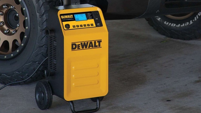 DeWalt battery charger and maintainer near car