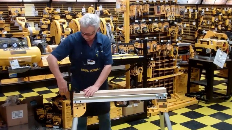 Person testing DeWalt work stand