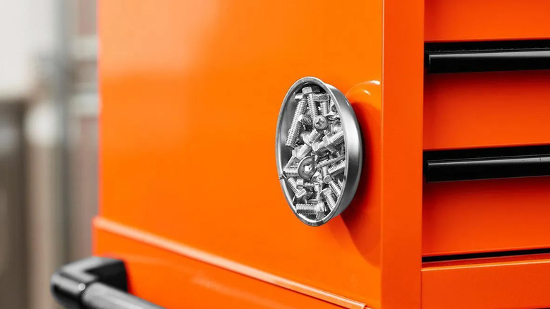 A magnetic parts tray on the side of a metal toolbox
