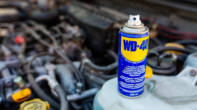 WD-40 can on a car's engine block