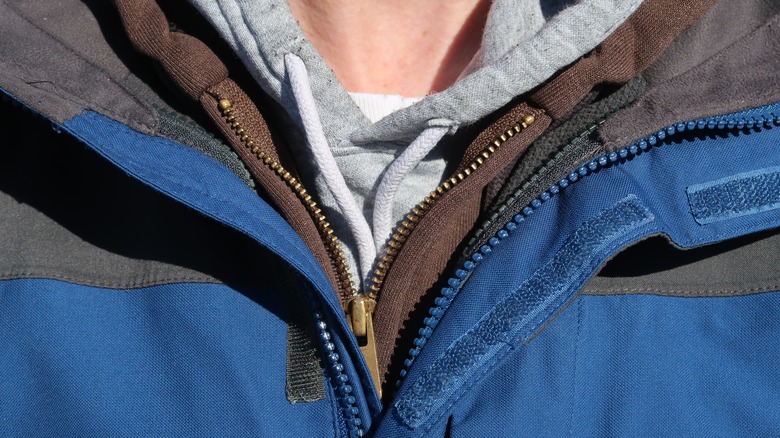 A person wearing three hoodies at once