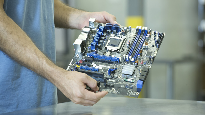 Man holding motherboard