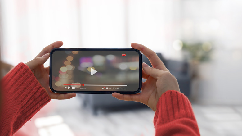 person watching video landscape mode