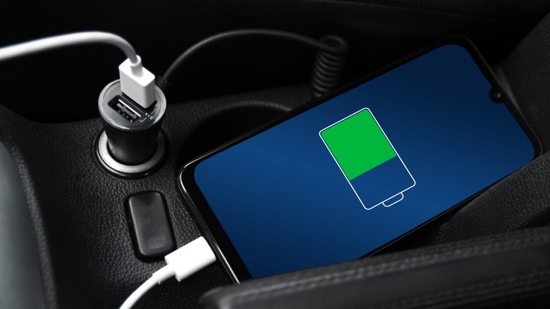 close up of a smartphone charging inside car
