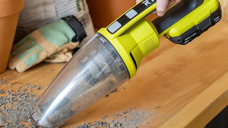 cleaning garden bench with Ryobi hand vacuum