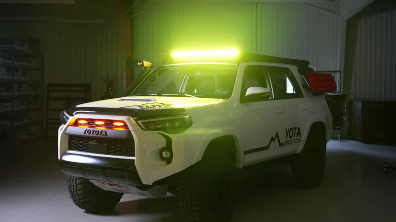 Fifth-gen Toyota 4Runner in a garage with off-road lights