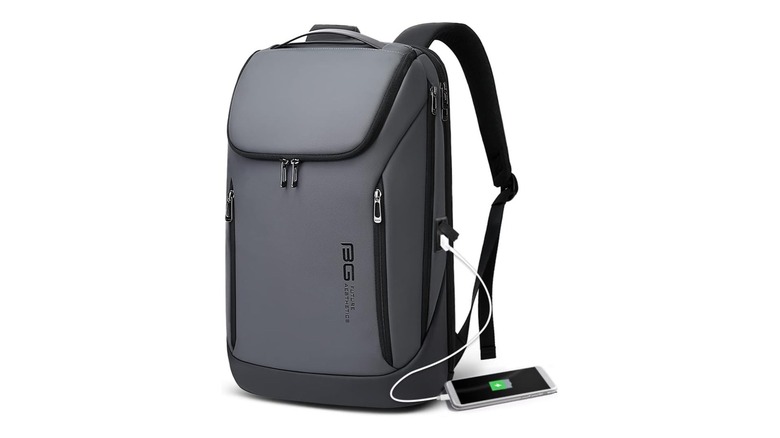 Gray backpack with mobile phone charging from it