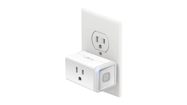 White square outlet plugged into a white two-socket outlet