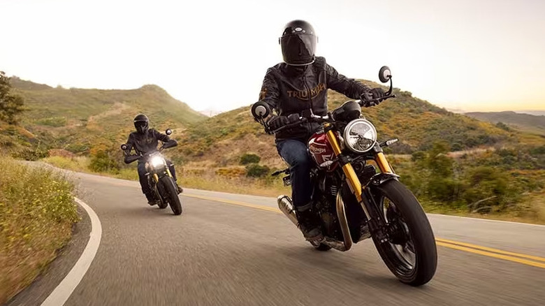 Triumph 400 being ridden on a mountain road