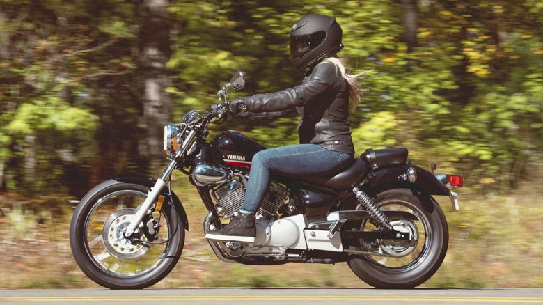 Yamaha V Star 250 side profile with a rider