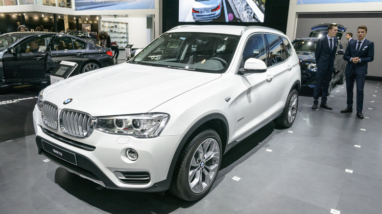 A white colored BMW X1 built on the F25 platform on an idoor display at the Brussels Auto Show
