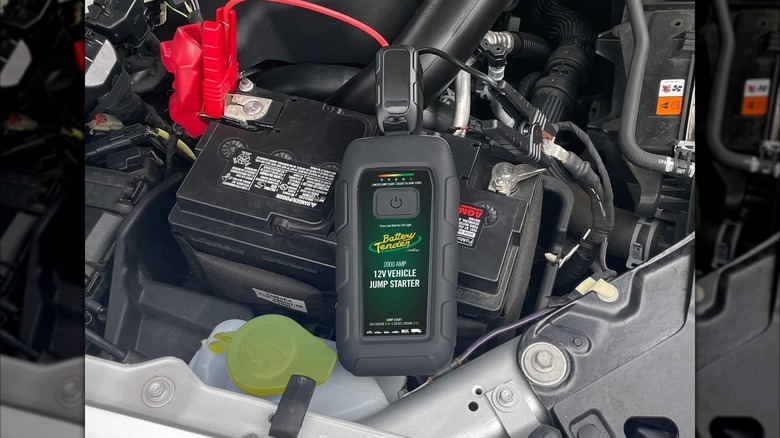 Battery Tender-branded device jumpstarting a car battery