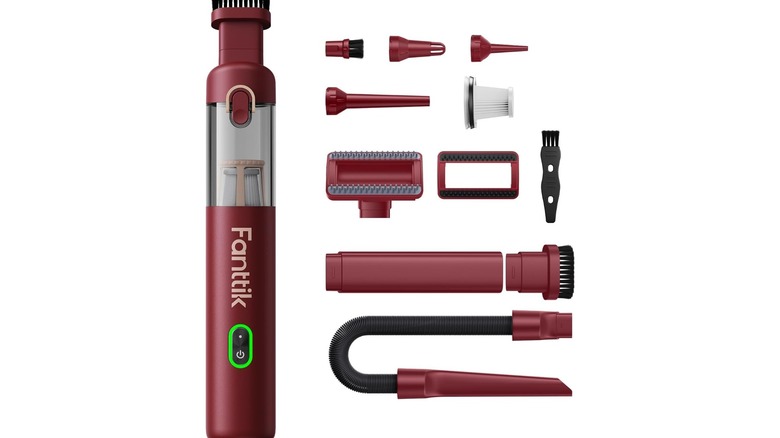 Cylindrical red hand vacuum with various attachments