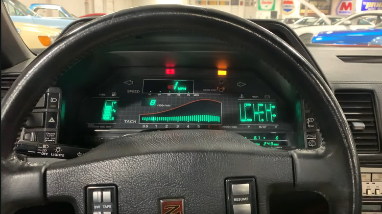 A driver's view of a 1986 Nissan 300ZX digital dashboard.
