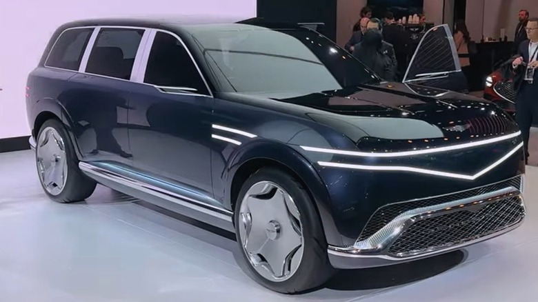 An ultra-luxury 2026 Genesis GV90 Neolun concept SUV on display at an auto show.