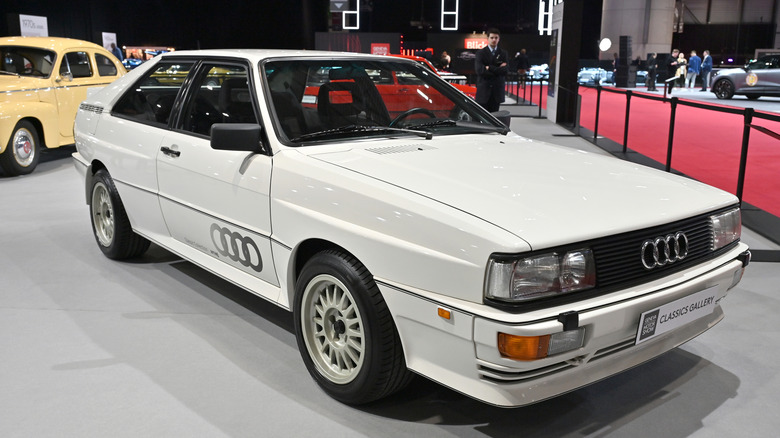 A white Audi Quattro on display at a car show