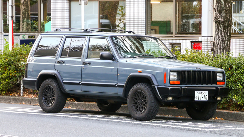 Grey Jeep Cherokee XJ parked on the streets of Tokyo