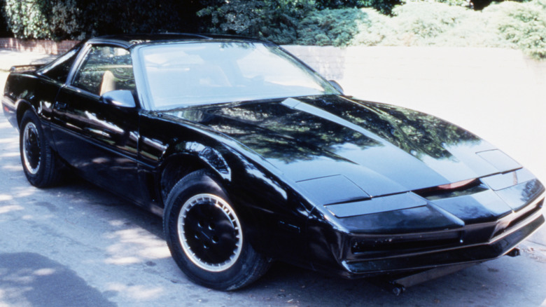 The black Pontiac Trans Am as KITT in Knight Rider parked on a road