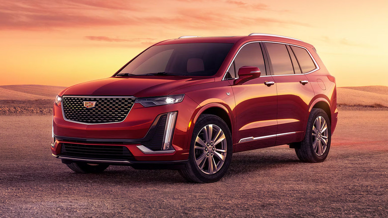 A red Cadillac XT6 parked
