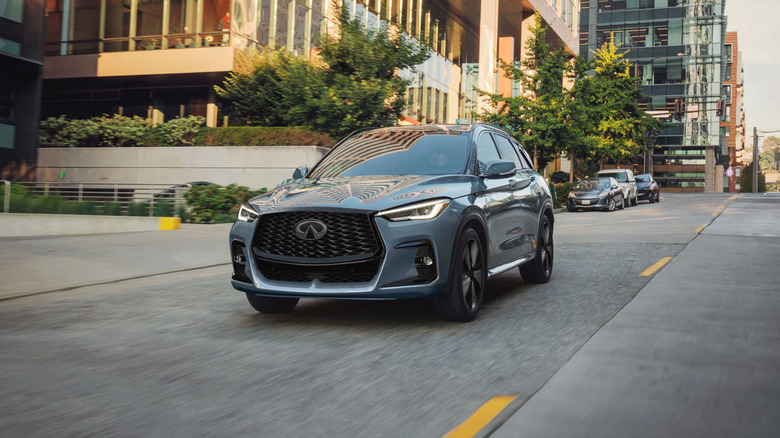 A gray Infiniti QX50 driving