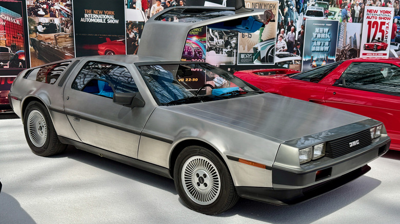 1981 DeLorean DMC-12 seen from right front parked with one gull wing door open at New York International Auto Show