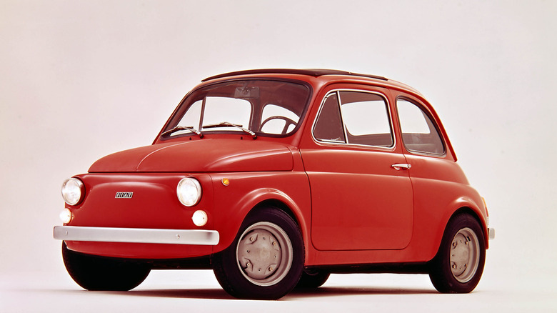 Red 1972-1975 Fiat 500 R seen from left front in studio