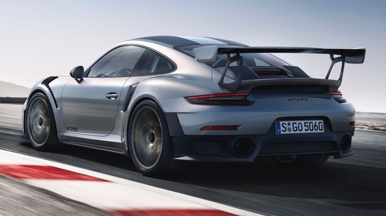 Porsche GT2 RS on a track rear 3/4