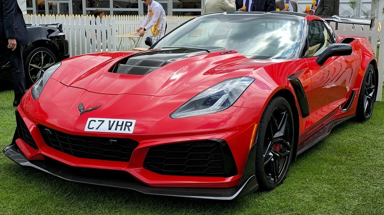 Red C7 Corvette ZR1 parked on the grass