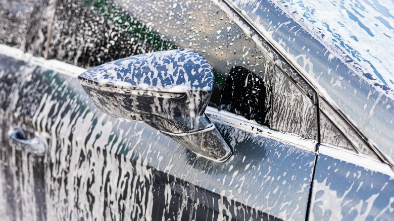 Close-up of car covered in soap